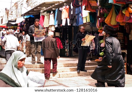 JERUSALEM - OCT 20: Mix of Jewish, Christian and Muslim people at Jerusalem old city market.Jerusalem is a holy city to the three major Abrahamic religions - Judaism, Christianity and Islam.