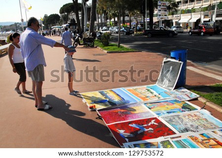 CANNES, FRANCE - MAY 07 2008:Artwork painting along Cannes Waterfront in Cannes,France.Cannes located on the French Riviera on the Mediterranean Sea and it's  best known for The Cannes Film Festival