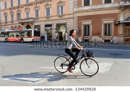 Rome - Apr 28:Italian Woman Rides Bicycle On April 28 2011 Rome,Italy.From May Till September The Historic Center Of Rome Is Closed To Automobile Every Second Sunday To Reduced Air And Noise Pollution