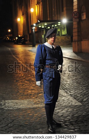 VATICAN - APR 29 2011:Pontifical Swiss Guard of the Holy in regular duty uniform  posted at St. Peter\'s Basilica, Vatican City Italy.Swiss Guard has served and protect the popes since the 16th century