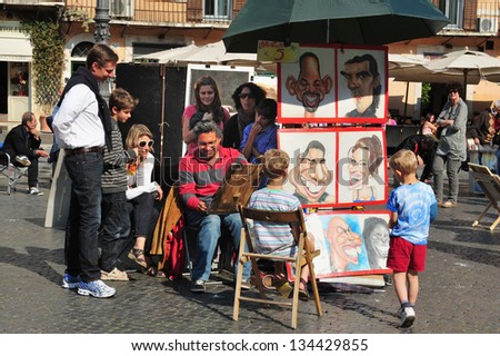 ROME - APRIL 28 2011:Street caricaturist paint caricature of a tourist in Piazza Navona in Rome Italy.Caricature is a rendered image show the features of its subject in a simplified or exaggerated way