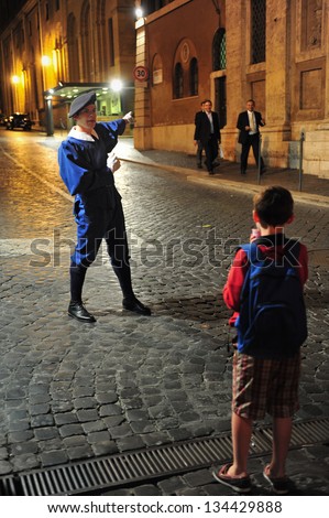 VATICAN - APR 29 2011:Pontifical Swiss Guard of the Holy in regular duty uniform  posted at St. Peter's Basilica, Vatican City Italy.Swiss Guard has served and protect the popes since the 16th century