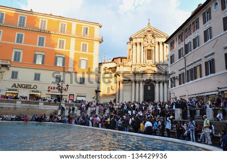 ROME - APRIL 28: Visitors at Trevi Fountain on April 28 2011 in Rome, Italy.It is the largest Baroque fountain in the city and one of the most famous fountains in the world.