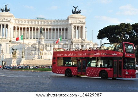 ROME - APR 28:Tourist bus pass by the Monument of Vittorio Emanuele II Rome,Italy on April 28 2011.It was built in honour of Victor Emmanuel, the first king of a unified Italy and completed in 1925.