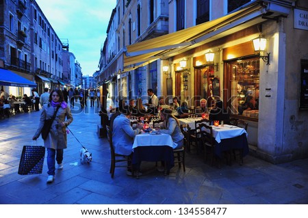 Venice - April 30:People Eats In A Restaurant On April 30 2011 In St Mark'S Square, Venice Italy.Each Year The Town Receives 18 Million Tourists. This Equates To Approximately 50,000 Visitors Each Day