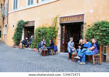 ROME - APRIL 29: Tourists sit in a cafe restaurant on April 29 2011. Rome today is one of the most important tourist destinations of the world with an average of 7-10 million tourists a year.