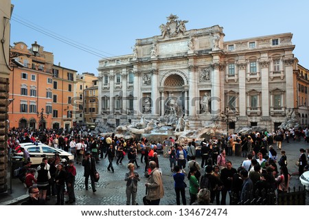ROME, ITALY - APRIL 28: Visitors at Trevi Fountain on April 28 2011 in Rome, Italy.The Trevi Fountain is 26 mt high and 20 mt wide, it is one of the most famous fountains in the world.