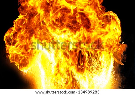 Massive mushroom shaped fire explosion with big flames.