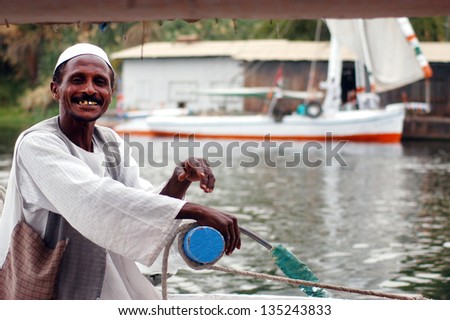 ASWAN - APRIL 30:Felucca sailor sails on the Nile river on April 30 2007 near Aswan, Egypt.The River Nile is about 6,670 km (4,160 miles) in length and is the longest river in Africa and in the world.