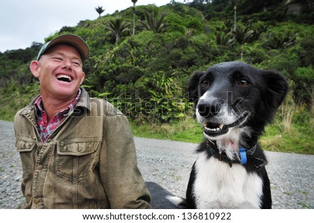 WEST COAST, NZ - APRIL 19:NZ farmer and his Border Collie dog on April 19 2009.It's one of the more remote and most sparsely populated areas in NZ with only 31,326 inhabitants (NZ census 2006 records)