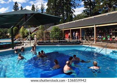 HANMER,NZ - MAR 15: Tourists enjoying hot pools in Hanmer springs on March 15 2009.Hanmer Springs is a very popular tourist destination in the south Island of NZ.