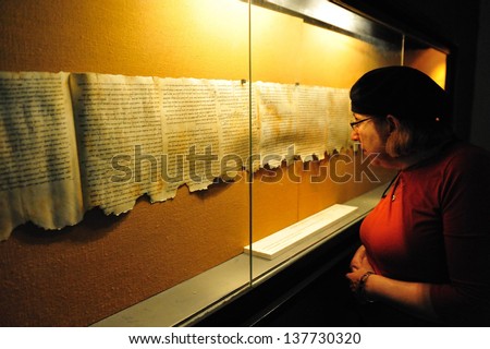 Qumran, Isr - Dec 14:Woman Looks At The Dead Sea Scrolls On Display At The Caves Of Qumran On December 14 2008.The Dead Sea Scrolls Were Discovered In Qumran Caves Between The Years 1947 And 1956.