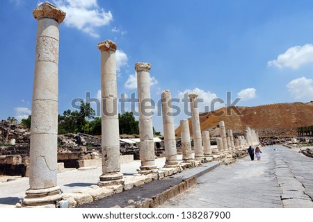 BEIT SHEAN,ISR - JUNE 17:Visitors walks under Pillars in Ancient Beit Shean on June 17 2009.Beit She'an is one of the most ancient sites in Israel: it was first settled 5-6 thousand years ago.