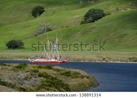 TAIPA,NZ -MAY 18:Two traditional double-hulled waka and their crews have arrived in Doubtless Bay in Northland New Zealand on May 18 2013. After a 10-month historic voyage across the pacific Ocean.