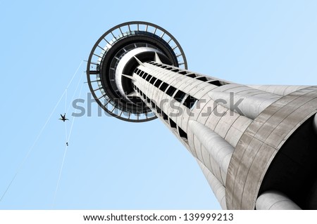 AUCKLAND, NZ - FEB 27: Person jumps from Auckland sky tower building on Feb 27 2009. SkyJump is one of New Zealand\'s most thrilling tourist attractions in Auckland, New Zealand.