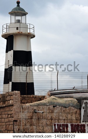 ACRE, ISR - DEC 13: Akko Light ( lighthouse) on Dec 13 2009.Acre Light, is an active lighthouse in the port of Acre, Israel. It is located on the South-West corner of the city\'s ancient walls.