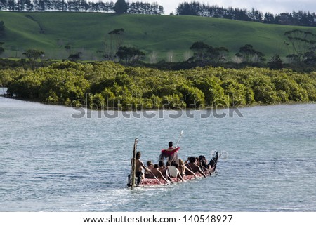 TAIPA,NZ - MAY 18:Maori War Waka on May 18 2013. Waka taua (war canoes) are large canoes manned by up to 80 paddlers and are up to 40 meters (130 ft) in length.