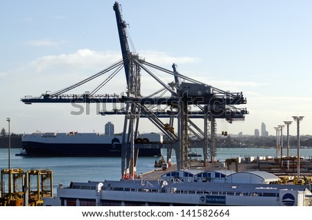 AUCKLAND,NZ - MAY 29:Cargo ship and container cranes on Fergusson Wharf at Ports of Auckland on May 29 2013.It\'s New Zealand\'s largest commercial port, its turnover of more than NZ$20 billion per year