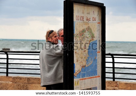 ACRE,ISR - DEC 13:Visitors look at a map of Acre on Dec 13 2009.Old Acre is one of Israel\'s main visiting spots.