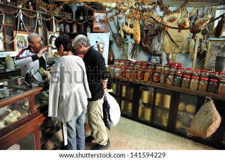 ACRE, ISR - MAY 13:Visitors buy goods in the old market of Acre on May 13 2009.Acre is one of the oldest continuously inhabited sites in Israel.