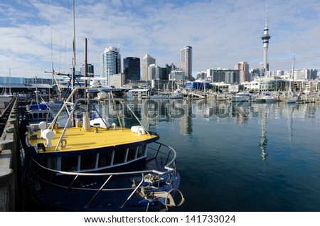 AUCKLAND - JUNE 02:Fishing boat in Auckland Viaduct Harbor Basin on June 02 2013.It\'s a former commercial harbor turned into a development of mostly upscale apartments, office space and restaurants.