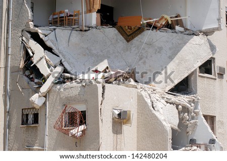 HAIFA, ISR - JULY 21:Bombed-out building that was struck by a Katyusha rocket fired from south Lebanon by Hezbollah on July 21, 2006.In the conflict 165 Israelis where killed and 500,000 displaced.