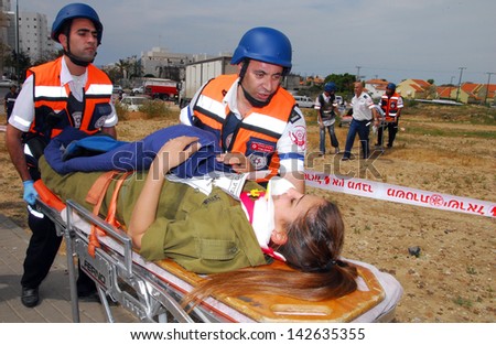 ASHKELON, ISR - APR 09:Emergency forces during a drill to simulate a rocket attack on  April 9, 2008.Since 2001 Palestinian rocket attacks on Israel have killed 64 Israelis as of November 21, 2012.