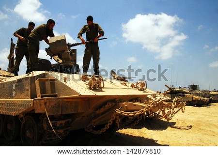 NIRIM, ISR - JUNE 11:Israeli fighters on M113 armored personnel carrieron in North Gaza strip on June 11 2008.Under its disengagement plan in 2005, Israel retained exclusive control over Gaza strip.