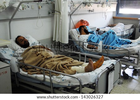 ASHKELON,ISR - AUG 03:Palestinian men rest in Barzilai Hospital on August 3, 2008.According to Israel Civil Administration, over 100,000 Palestinians received medical care in Israel every year.