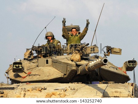 NACHAL OZ, ISR - NOV 12:Israeli soldiers on Merkava tank on NOV 12 2008.It\'s IDF battle tank designed for rapid repair of battle damage, survivability, cost-effectiveness and off-road performance