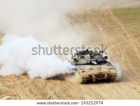 NACHAL OZ, ISR - NOV 12:Merkava patrols along Gaza on NOV 12 2008.It\'s IDF battle tank designed for rapid repair of battle damage, survivability, cost-effectiveness and off-road performance.