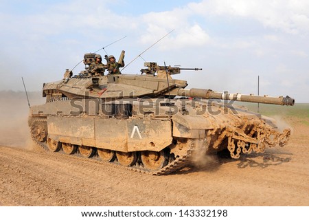 NACHAL OZ, ISR - NOV 12:Merkava patrols along Gaza on NOV 12 2008.It\'s IDF battle tank designed for rapid repair of battle damage, survivability, cost-effectiveness and off-road performance.