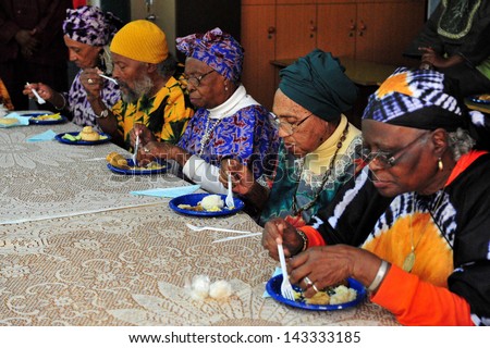 DIMONA,ISR - NOV 06:Elderly members of the Black Hebrew community eat a strict vegan meal on Nov 3 2008.The group maintains a vegan diet as part in their belief in God\'s promises to Adam in Genesis.
