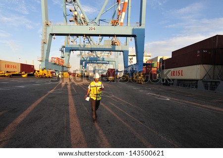 ASHDOD - NOV 09:Docker / Port worker in Port of Ashdod on Nov 09 2009.It\'s one of Israel\'s two main cargo ports and one of the few deep water ports in the world to be built on the open sea.