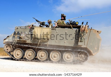 NACHAL OZ, ISR - JUNE 07:Israeli fighters on M113 armored personnel carrieron in North Gaza strip on June 07 2008.Under its disengagement plan in 2005,Israel retained exclusive control over Gaza strip