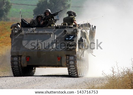 NACHAL OZ, ISR - JUNE 07:Israeli fighters on M113 armored personnel carrieron in North Gaza strip on June 07 2008.Under its disengagement plan in 2005,Israel retained exclusive control over Gaza strip