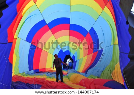 WESTERN NEGEV, ISR - MAR 04:Man inside an hot air balloons on March 04 2010.The largest hot air balloon is the Energizer Bunny Hot Hare Balloon measuring 166 feet tall.