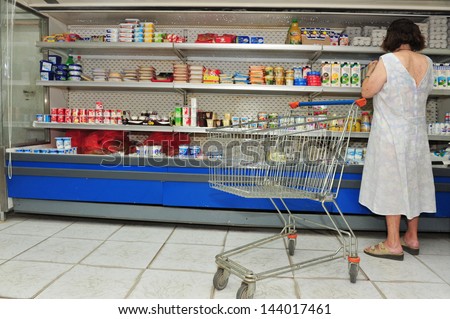 ASHDOD - JULY 14:Israeli woman boycott cottage cheese on July 14 2011.Israelis stop buying the cheese which perceived as a basic food item to protest against continuing rise of food prices in Israel.