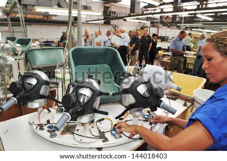 KIRYAT GAT, ISR - OCT 04:Workers at gas masks factory on Oct 04 2010.Only 58% percent of Israelis have gas masks.It estimated that it will coast $350 million USD to cover the rest of the population.