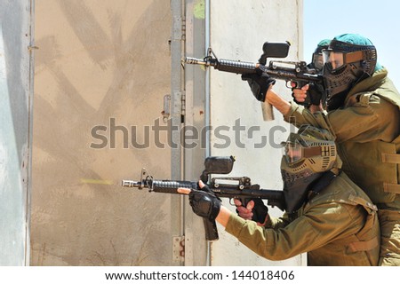 TZEELIM, ISR - MAY 23:Israeli special forces trains with paintball guns on May 23 2011.Paintball technology used by military forces, law enforcement and security organizations to save money and ammo.