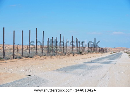 NITZANA, ISR - NOV 22:The Israeli Egyptian border fence on Nov 22 2010.Following increased terrorist penetration Israel is upgrading the steel barrier to include cameras,radar and motion detectors.