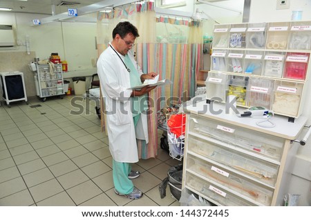 ASHKELON, ISR - JULY 14:Doctor on duty in Barzilai medical center emergency department on JULY 14 2011. The emergency departments of most hospitals in the world operate 24 hours a day.