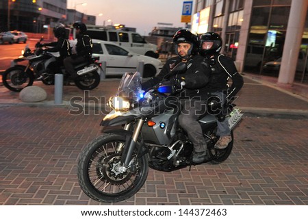 ASHDOD, ISR - JUNE 13:Wielding Yassam officers team on a Kawasaki KLE 500 motorcycle on June 13 2010.It\'s Israel Police special patrol unit dedicated for crowd control and special operations.