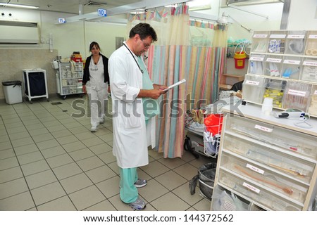 ASHKELON, ISR - JULY 14:Madical staff on duty in Barzilai medical center emergency department on JULY 14 2011. The emergency departments of most hospitals in the world operate 24 hours a day.