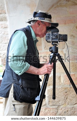 JERUSALEM - OCT 29:Travel photographer taking photos on Oct 29 2010.Most photographers are self-employed and only the most skilled and talented with good business sense maintain long-term careers.