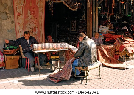 TEL AVIV - JAN 10:Tailors weaving Persian carpets on Jan 10 2005.Persian rugs are counted among the world\'?s most beautiful native artworks and considered the most valuable crafts of the modern world.
