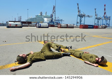ASHDOD, ISRAEL - JUNE 22: The Israeli soldiers during exercise which simulates a chemical and biological rocket attack on Ashdod Port, Israel on June 22, 2011.