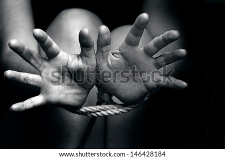 Hands Tied Up With Rope Of A Missing Kidnapped, Abused, Hostage, Victim Woman In Pain, Afraid, Restricted, Trapped, Call For Help, Struggle, Terrified, Threaten, Locked In A Cage Cell.