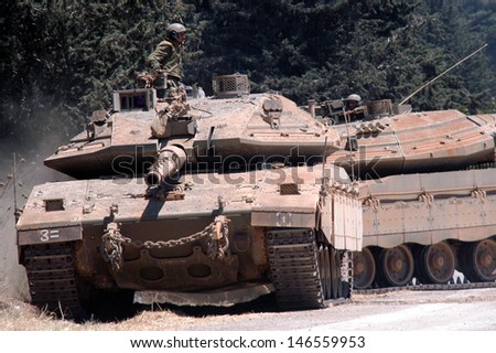 NORTH ISRAEL - JULY 26:Israeli soldier and tanks on Israel Lebanon border on July 26 2006. In the conflict 165 Israelis where killed and 500,000 displaced.