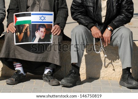 EREZ CROSSING, JAN 11:Arab Israeli men protest on Feb 11, 2010. The group call Hamas to release captured Israeli soldier Gilad Shalit in return for the exchange of Palestinian prisoners in Israel.